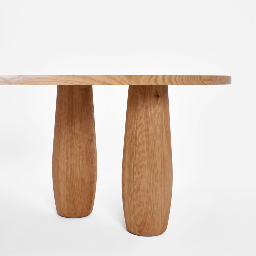 Asymmetric White Dining Table With Oval Legs