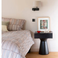 Small bedside table for compact bedroom spaces

