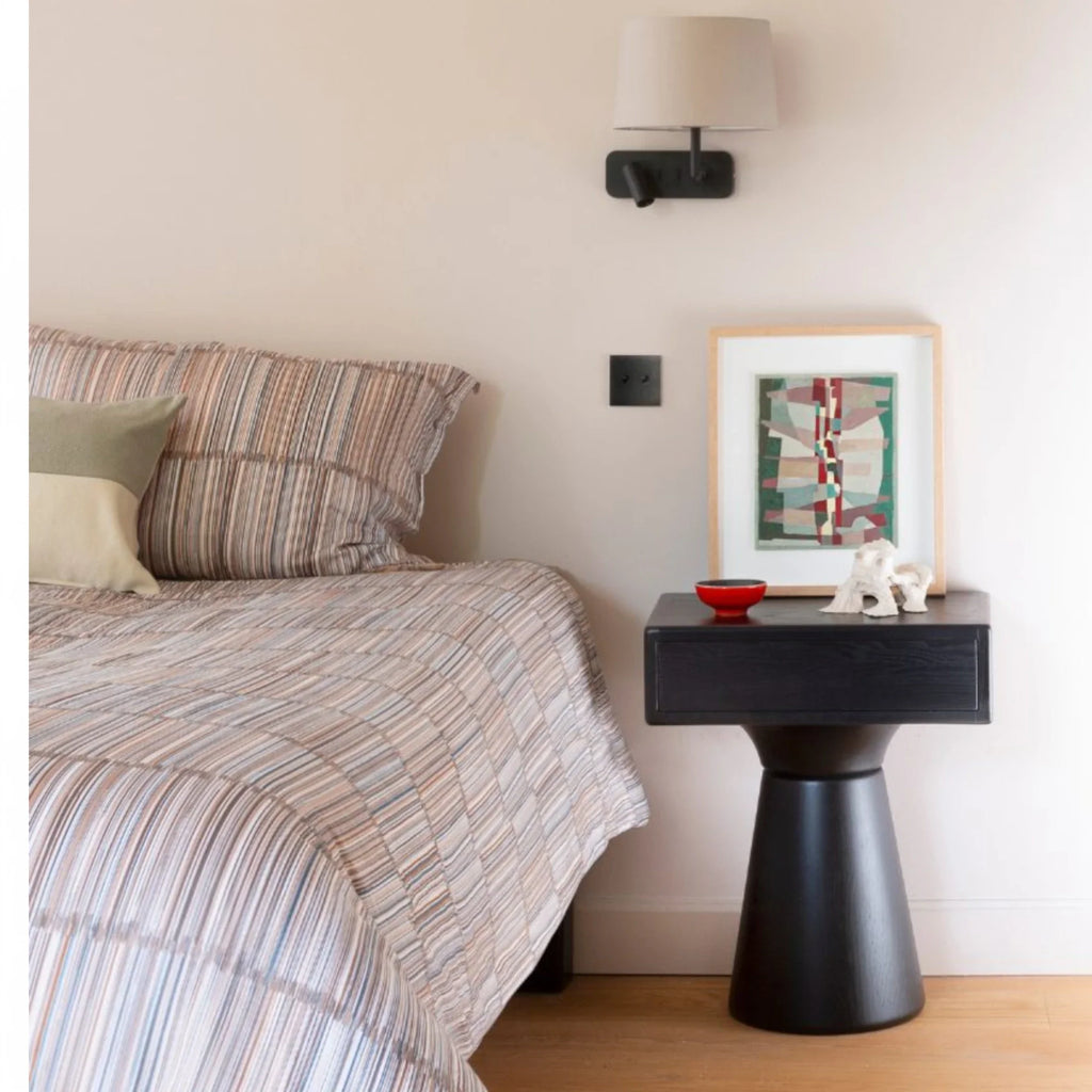 Small bedside table for compact bedroom spaces

