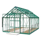 A green metal-framed Rhino Greenhouse stands empty, showcasing open interior space with growing beds. The structure features transparent panels and cross-bracing, set against a plain white background.
