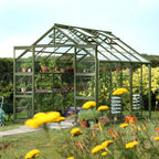 tuscan olive greenhouse in a well maintained garden setting