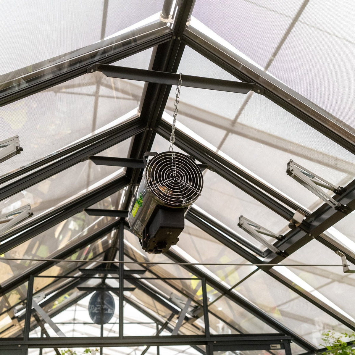 greenhouse heater hanging from roof of greenhouse