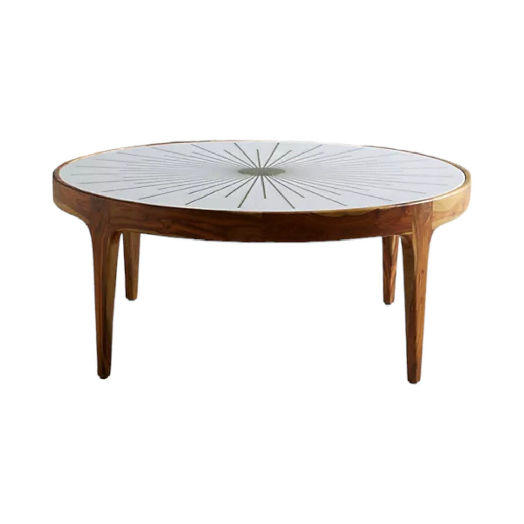 Close-up of handcrafted brass detailing on starburst coffee table