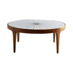 Close-up of handcrafted brass detailing on starburst coffee table